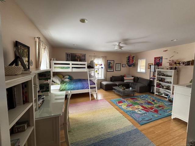 bedroom featuring hardwood / wood-style flooring and ceiling fan