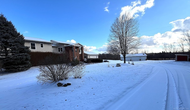 view of yard layered in snow