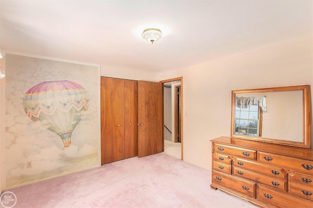 carpeted bedroom featuring a closet