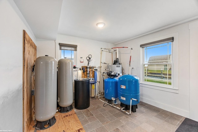 utility room featuring gas water heater