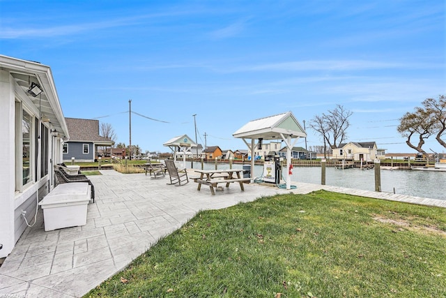 view of patio / terrace featuring a boat dock and a water view