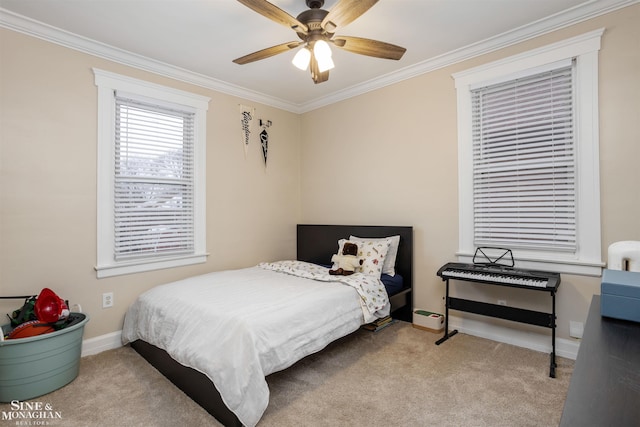 bedroom with light colored carpet, ceiling fan, and ornamental molding