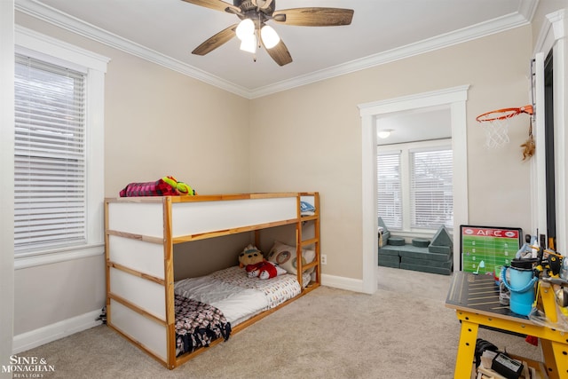 bedroom featuring ceiling fan, carpet floors, and ornamental molding