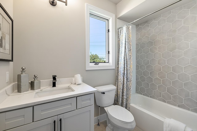 full bathroom featuring vanity, toilet, and shower / tub combo