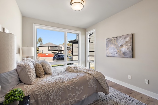 bedroom with hardwood / wood-style floors