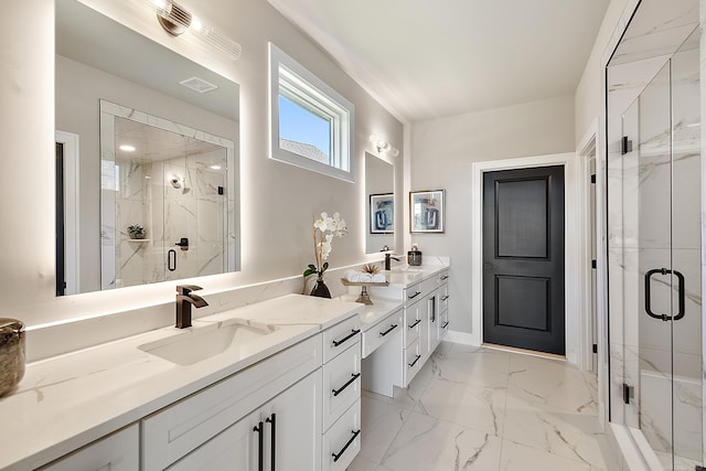 bathroom featuring a shower with door and vanity