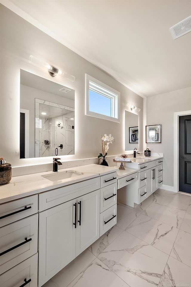 bathroom with vanity and a shower with shower door