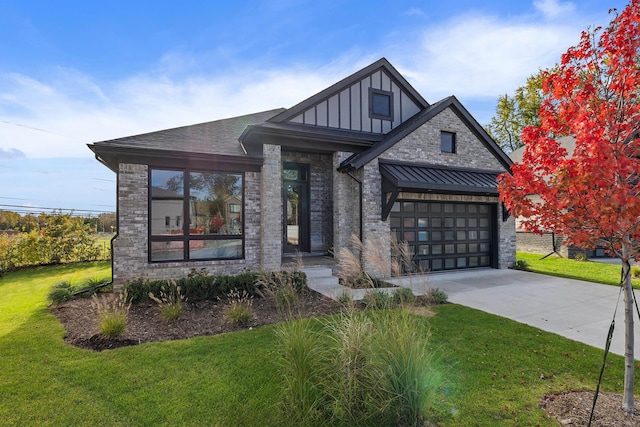 view of front of home with a front yard and a garage