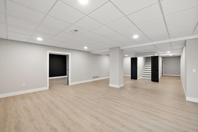 basement featuring light wood-type flooring