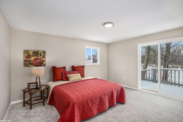 carpeted bedroom featuring access to outside