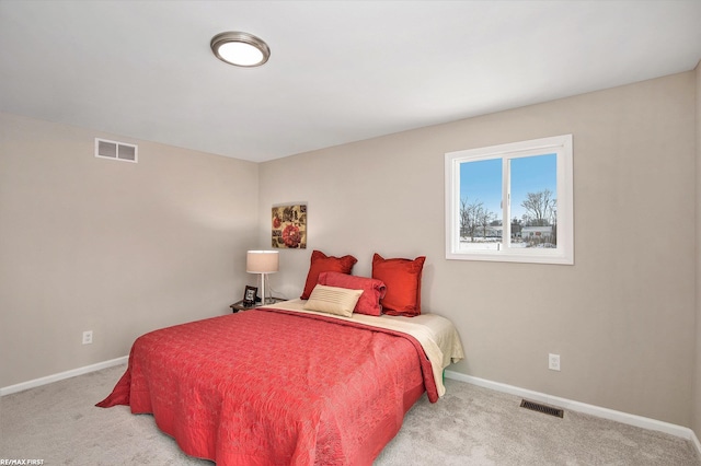 bedroom with light carpet