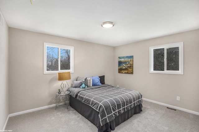 bedroom featuring light colored carpet