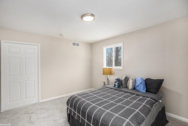 carpeted bedroom featuring a closet