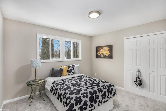 bedroom with light carpet and a closet