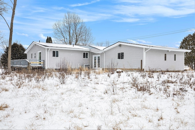 view of snow covered house