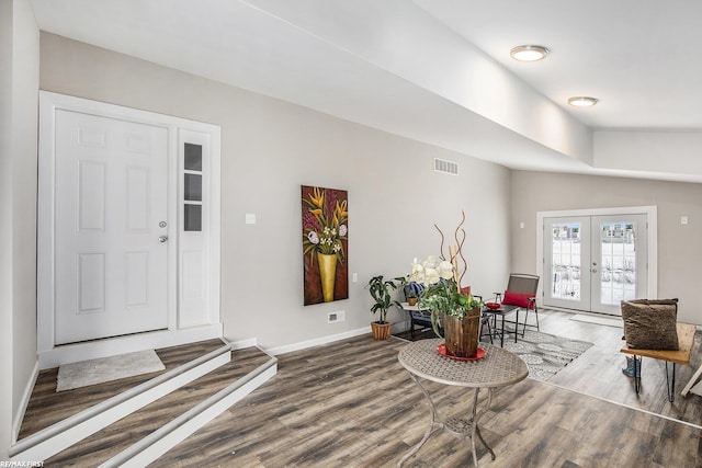 living room featuring french doors and hardwood / wood-style flooring