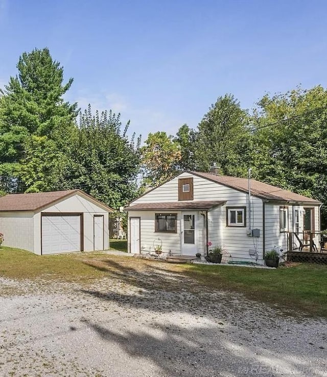 view of front facade with a garage and an outdoor structure