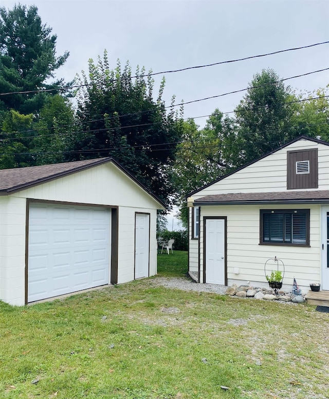 garage with a yard