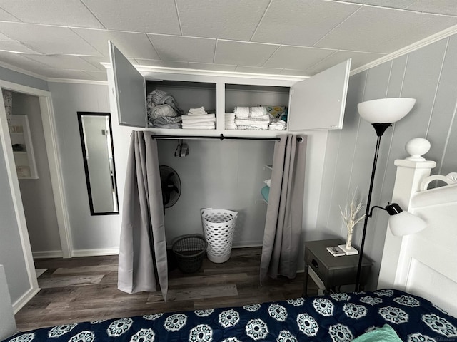 mudroom with wood finished floors, baseboards, and ornamental molding