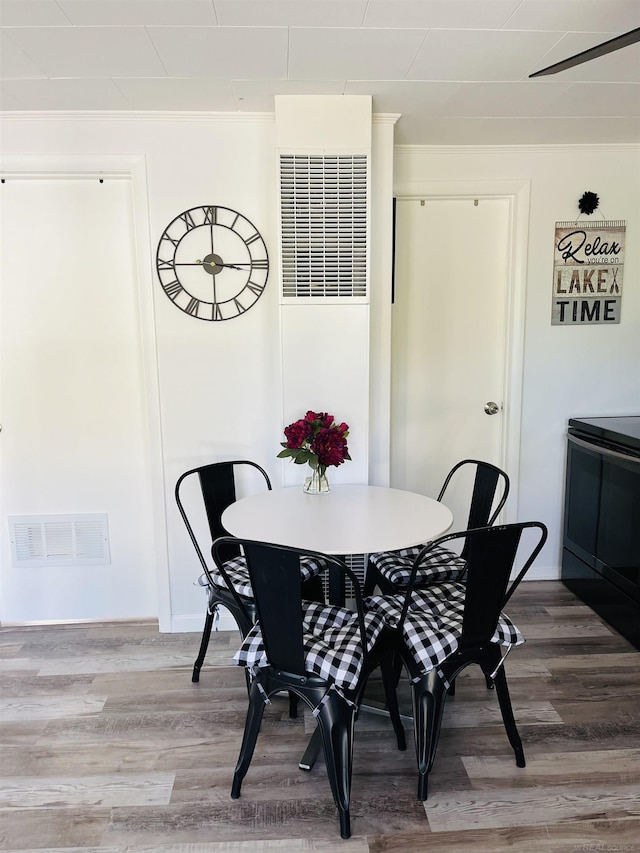 dining area featuring hardwood / wood-style floors