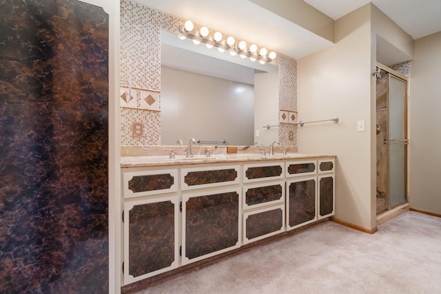 bathroom featuring vanity and a shower with shower door