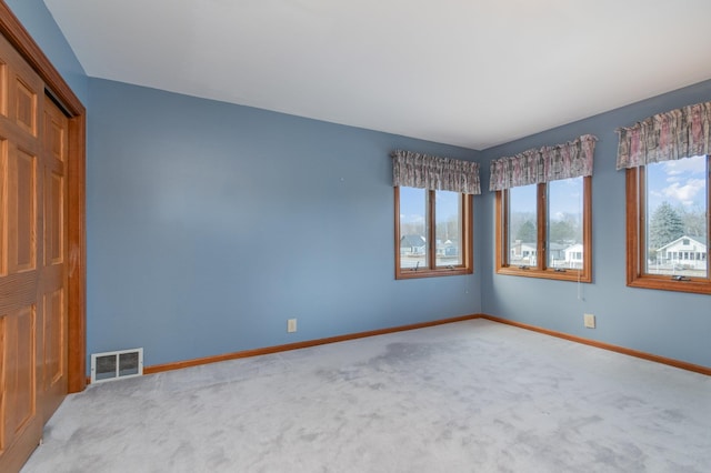 spare room with light colored carpet