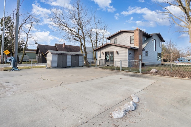 view of side of property featuring a shed