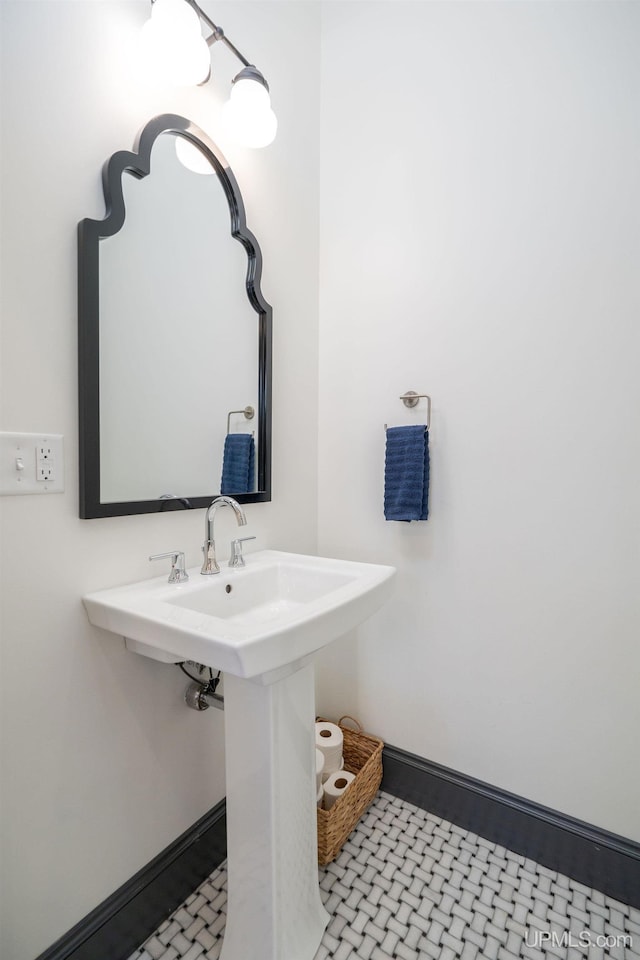 bathroom with tile patterned flooring