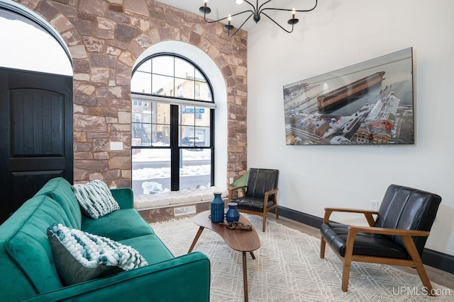 living room featuring hardwood / wood-style floors and a chandelier