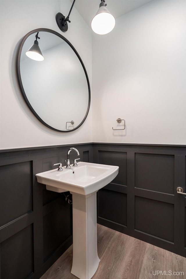 bathroom with hardwood / wood-style flooring