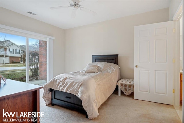 bedroom featuring ceiling fan and light colored carpet