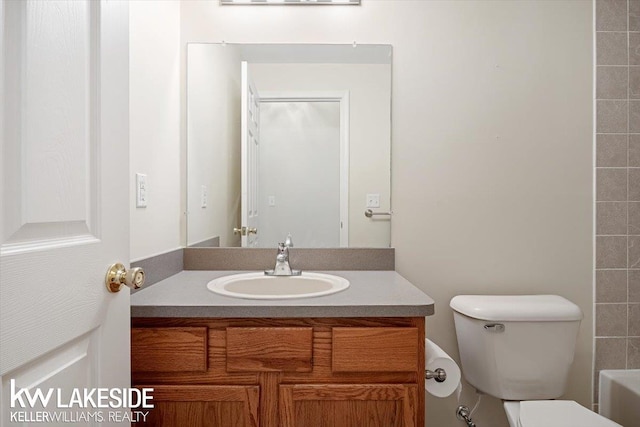 bathroom with toilet and vanity