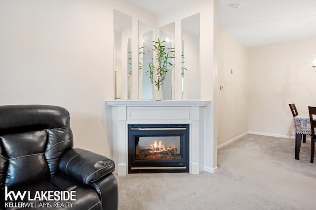 sitting room featuring light colored carpet