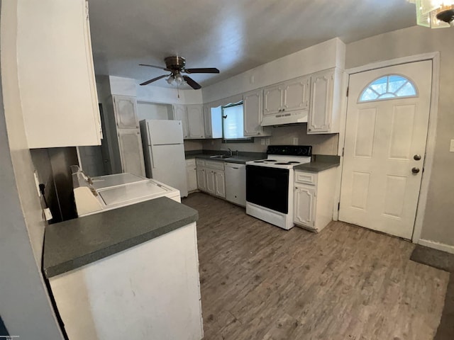 kitchen with white appliances, wood-type flooring, ceiling fan, sink, and white cabinetry