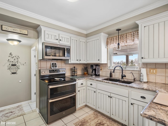 kitchen with white cabinets, appliances with stainless steel finishes, and sink