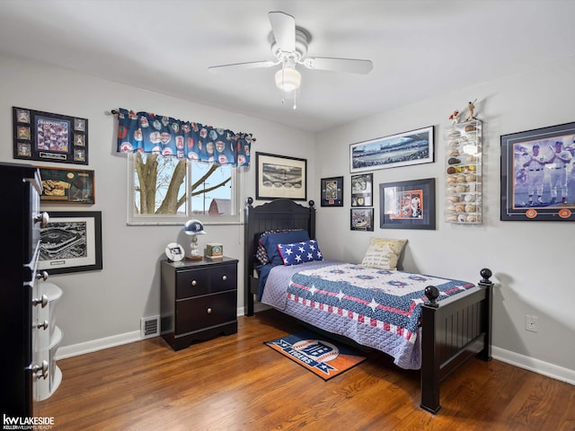 bedroom featuring ceiling fan and dark hardwood / wood-style floors