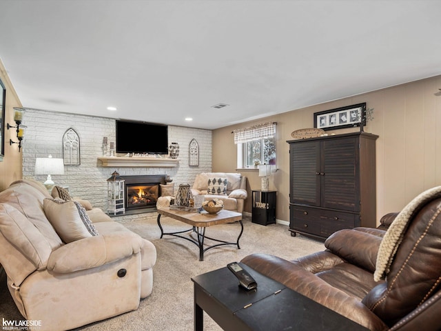 living room featuring light carpet and a brick fireplace