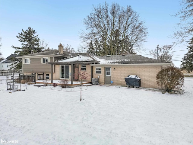 view of snow covered house