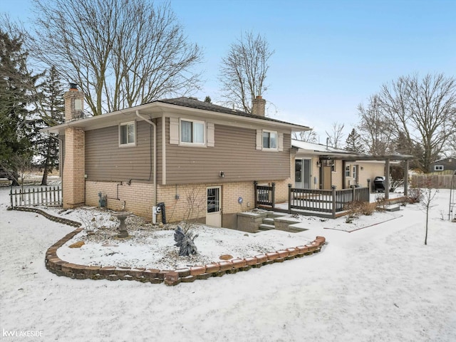 view of snow covered house