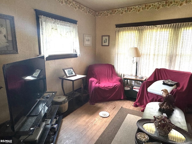 interior space with a healthy amount of sunlight and hardwood / wood-style floors