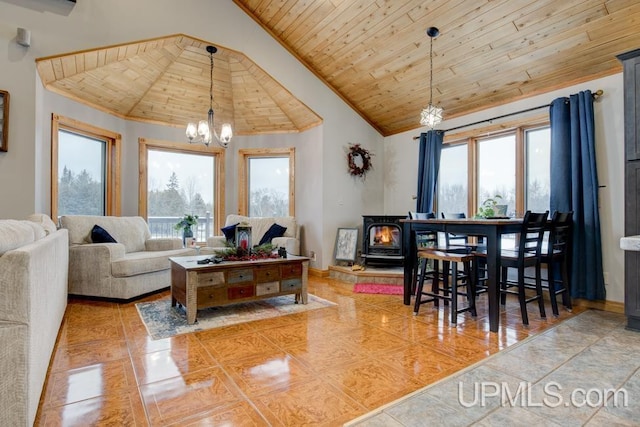 tiled living room featuring an inviting chandelier, wooden ceiling, high vaulted ceiling, and a wood stove