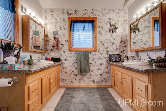 bathroom with tile patterned flooring and vanity