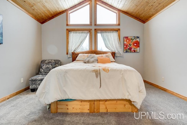 carpeted bedroom with wooden ceiling and vaulted ceiling