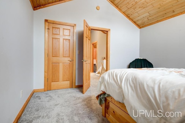 bedroom featuring wooden ceiling, vaulted ceiling, and carpet flooring