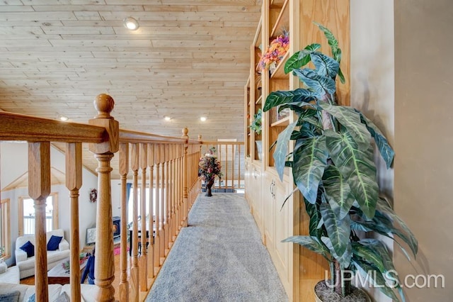 corridor with wooden ceiling and carpet