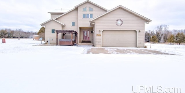 view of front of home featuring a jacuzzi and a garage