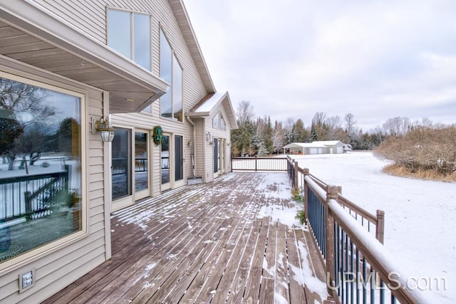 view of snow covered deck