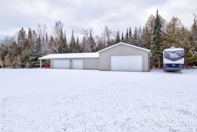 view of snow covered garage