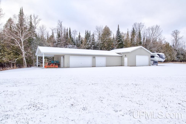 view of snow covered garage