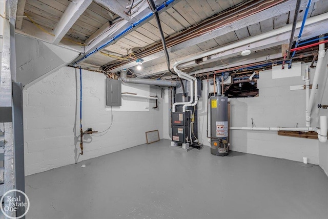 basement featuring electric panel, heating unit, and gas water heater